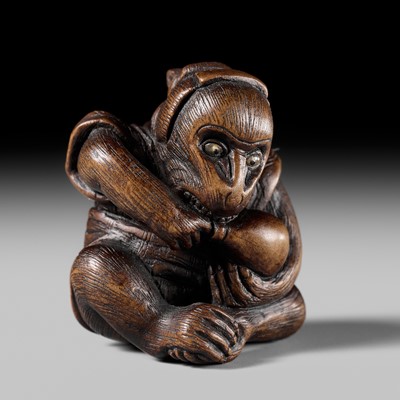 SUKEYUKI: A FINE WOOD NETSUKE OF A PERFORMING MONKEY