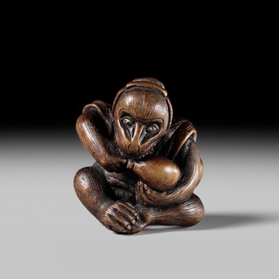 SUKEYUKI: A FINE WOOD NETSUKE OF A PERFORMING MONKEY