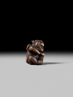 SUKEYUKI: A FINE WOOD NETSUKE OF A PERFORMING MONKEY
