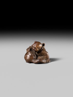 Lot 441 - YOSHIHIDE: A VERY FINE WOOD NETSUKE OF A PRIEST STARTLED BY A TANUKI KETTLE