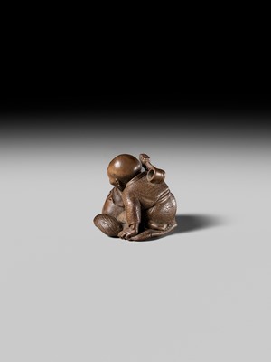 Lot 441 - YOSHIHIDE: A VERY FINE WOOD NETSUKE OF A PRIEST STARTLED BY A TANUKI KETTLE