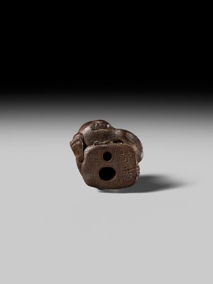 Lot 441 - YOSHIHIDE: A VERY FINE WOOD NETSUKE OF A PRIEST STARTLED BY A TANUKI KETTLE