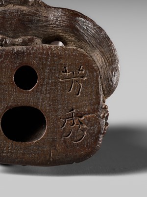 Lot 441 - YOSHIHIDE: A VERY FINE WOOD NETSUKE OF A PRIEST STARTLED BY A TANUKI KETTLE