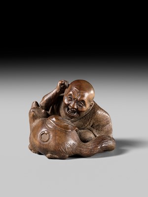 Lot 441 - YOSHIHIDE: A VERY FINE WOOD NETSUKE OF A PRIEST STARTLED BY A TANUKI KETTLE