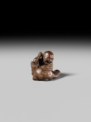 Lot 441 - YOSHIHIDE: A VERY FINE WOOD NETSUKE OF A PRIEST STARTLED BY A TANUKI KETTLE