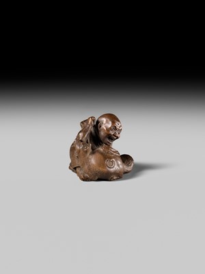 Lot 441 - YOSHIHIDE: A VERY FINE WOOD NETSUKE OF A PRIEST STARTLED BY A TANUKI KETTLE