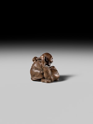Lot 441 - YOSHIHIDE: A VERY FINE WOOD NETSUKE OF A PRIEST STARTLED BY A TANUKI KETTLE