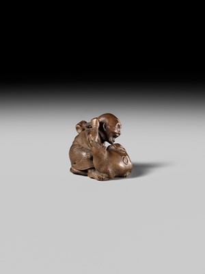Lot 441 - YOSHIHIDE: A VERY FINE WOOD NETSUKE OF A PRIEST STARTLED BY A TANUKI KETTLE