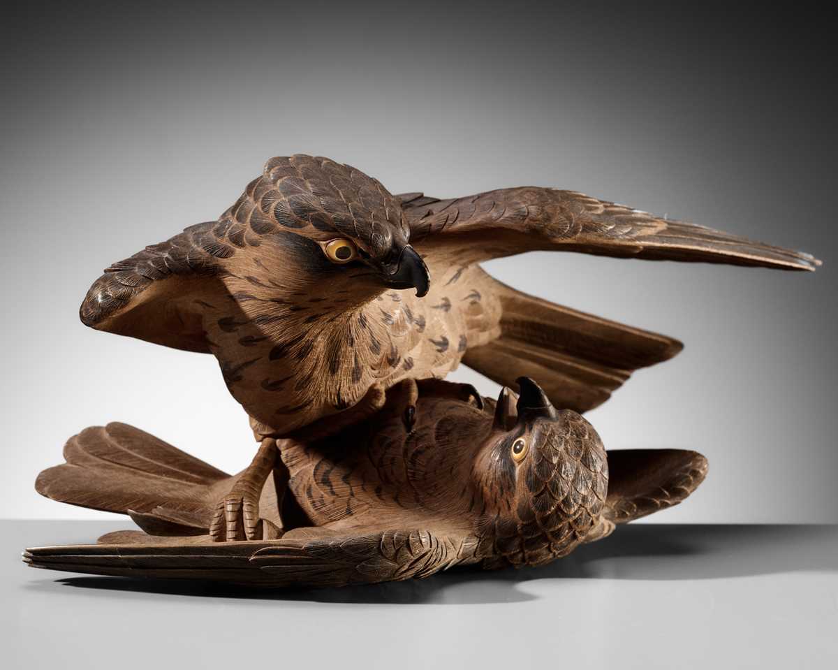 A LARGE WOOD OKIMONO OF TWO QUARRELING SPARROWS