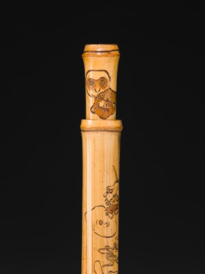 ASANO BOKKOKU: A FINE BAMBOO KISERUZUTSU (PIPE CASE) WITH MASKS