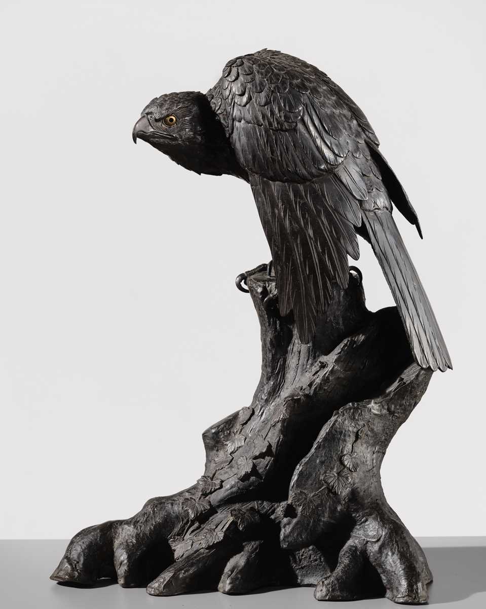 Lot 19 - A LARGE AND FINE BRONZE OKIMONO OF A HAWK ON A TREE TRUNK