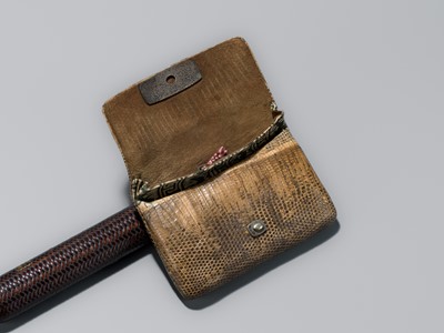 ISSHAKUSAI: A LACQUERED WOVEN RATTAN KISERUZUTSU (PIPE CASE) AND TABAKO-IRE (POUCH)