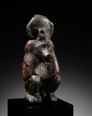 Lot 5 - A RARE BRONZE FIGURE OF A BABOON, LATE DYNASTIC PERIOD, DYNASTY XXVI