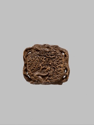 Lot 58 - A FINE WOOD TONKOTSU WITH DRAGONS AND A TIGER