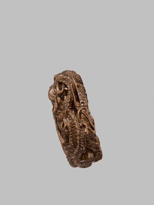Lot 58 - A FINE WOOD TONKOTSU WITH DRAGONS AND A TIGER