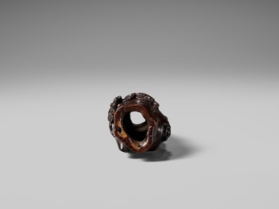 AN UNUSUAL AND RARE COCONUT NETSUKE OF MONKEYS AND A TOAD ON A PINE TREE