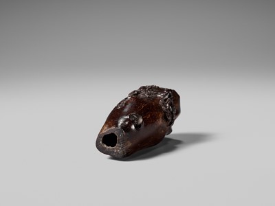 AN UNUSUAL AND RARE COCONUT NETSUKE OF MONKEYS AND A TOAD ON A PINE TREE