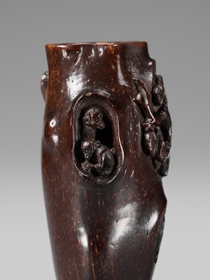 AN UNUSUAL AND RARE COCONUT NETSUKE OF MONKEYS AND A TOAD ON A PINE TREE