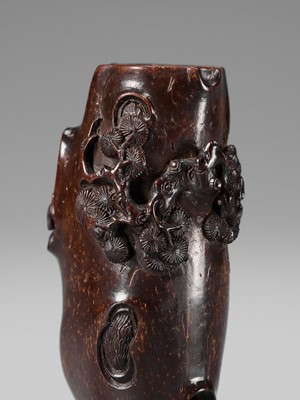 AN UNUSUAL AND RARE COCONUT NETSUKE OF MONKEYS AND A TOAD ON A PINE TREE