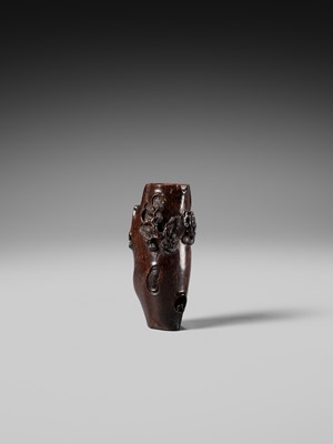 AN UNUSUAL AND RARE COCONUT NETSUKE OF MONKEYS AND A TOAD ON A PINE TREE