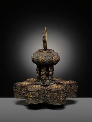Lot 11 - A PARCEL-GILT COPPER REPOUSSÉ BUDDHIST RITUAL CONTAINER, NEPAL, 16TH-17TH CENTURY