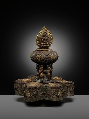 Lot 11 - A PARCEL-GILT COPPER REPOUSSÉ BUDDHIST RITUAL CONTAINER, NEPAL, 16TH-17TH CENTURY