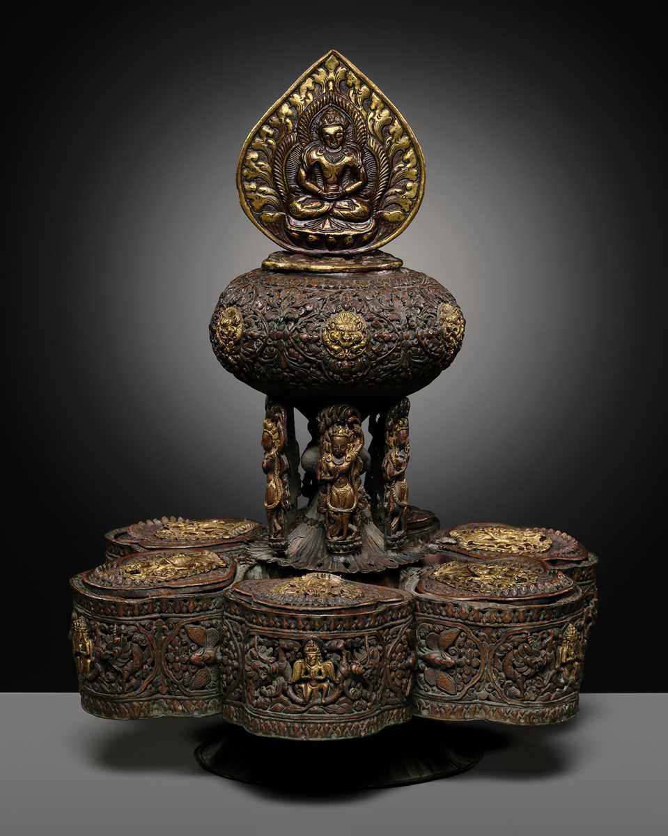 Lot 11 - A PARCEL-GILT COPPER REPOUSSÉ BUDDHIST RITUAL CONTAINER, NEPAL, 16TH-17TH CENTURY