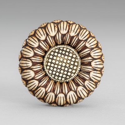 Lot 1573 - A FINE IVORY MANJU NETSUKE IN THE FORM OF A CHRYSANTHEMUM