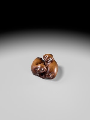 A WOOD NETSUKE OF TWO PUPPIES AT PLAY, ATTRIBUTED TO MASANAO OF KYOTO