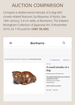 A WOOD NETSUKE OF TWO PUPPIES AT PLAY, ATTRIBUTED TO MASANAO OF KYOTO