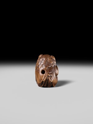 A POWERFUL HINOKI WOOD NETSUKE OF A SHISHIMAI DANCER
