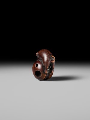 A FINE KYOTO SCHOOL WOOD NETSUKE OF A PUPPY BALANCING ON A KEMARI BALL, ATTRIBUTED TO OKATOMO