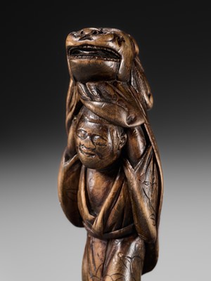 A LARGE HINOKI WOOD NETSUKE OF A SHISHIMAI DANCER