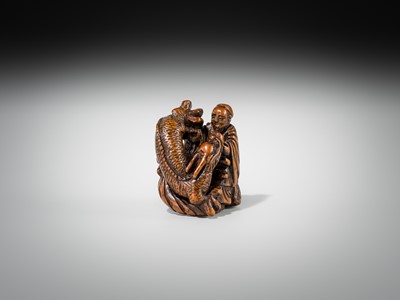 Lot 446 - A POWERFUL WOOD NETSUKE OF BASHIKO SENNIN