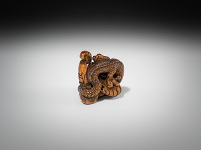 Lot 446 - A POWERFUL WOOD NETSUKE OF BASHIKO SENNIN