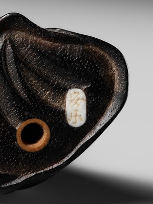 Lot 170 - ANRAKU: A FINE AND HUMOROUS WOOD NETSUKE OF TANUKI DISGUISED AS A PRIEST