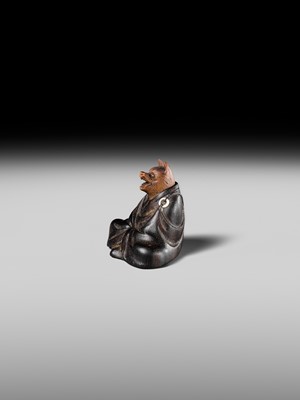 Lot 170 - ANRAKU: A FINE AND HUMOROUS WOOD NETSUKE OF TANUKI DISGUISED AS A PRIEST