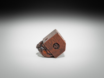 Lot 392 - MASATOMO: A HUMOROUS WOOD NETSUKE OF AN ONI AT SETSUBUN