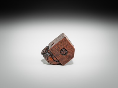 Lot 392 - MASATOMO: A HUMOROUS WOOD NETSUKE OF AN ONI AT SETSUBUN