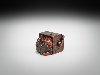 Lot 392 - MASATOMO: A HUMOROUS WOOD NETSUKE OF AN ONI AT SETSUBUN