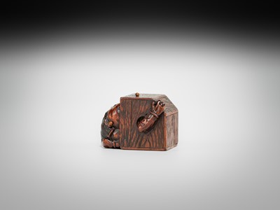 Lot 392 - MASATOMO: A HUMOROUS WOOD NETSUKE OF AN ONI AT SETSUBUN