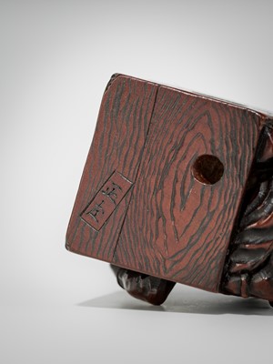 Lot 392 - MASATOMO: A HUMOROUS WOOD NETSUKE OF AN ONI AT SETSUBUN