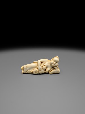 Lot 103 - AN EARLY IVORY NETSUKE OF OKAME WITH CHILD