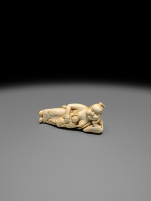 Lot 103 - AN EARLY IVORY NETSUKE OF OKAME WITH CHILD