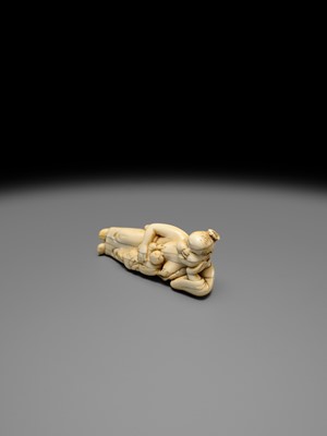 Lot 103 - AN EARLY IVORY NETSUKE OF OKAME WITH CHILD