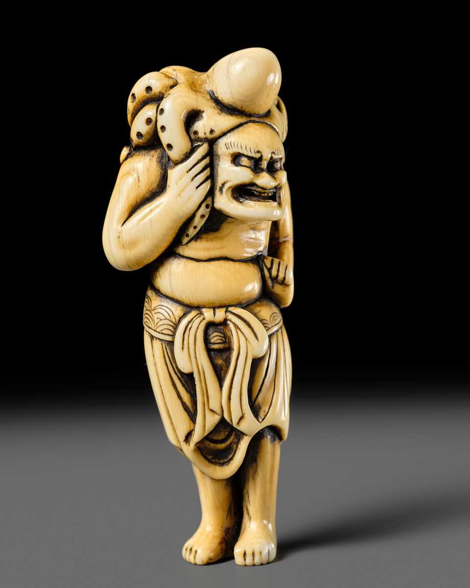 Lot 111 - A POWERFUL IVORY NETSUKE OF RYUJIN’S ATTENDANT
