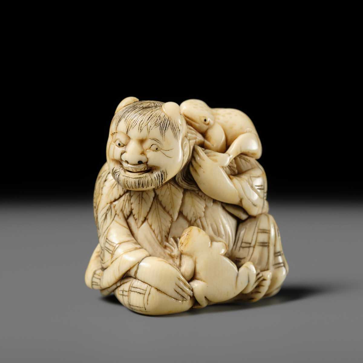 Lot 112 - A FINE IVORY NETSUKE OF GAMA SENNIN WITH TWO TOADS
