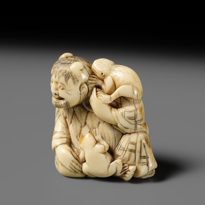 Lot 112 - A FINE IVORY NETSUKE OF GAMA SENNIN WITH TWO TOADS