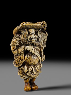 Lot 127 - A POWERFUL KYOTO SCHOOL IVORY NETSUKE OF SHOKI AND ONI