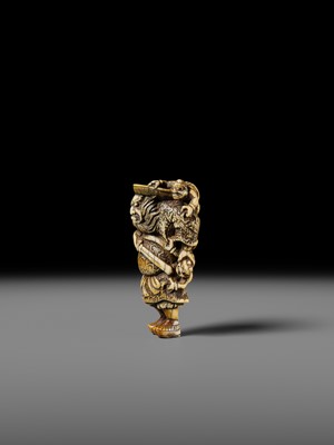 Lot 127 - A POWERFUL KYOTO SCHOOL IVORY NETSUKE OF SHOKI AND ONI